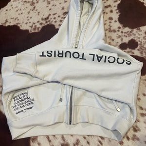 Social tourist hoodie worn around 10-12 times but washed properly